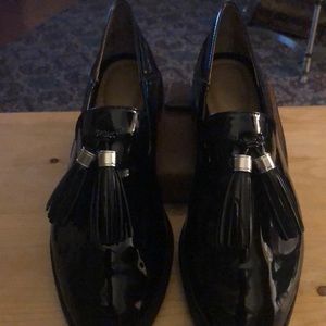 Black patent loafers with tassels